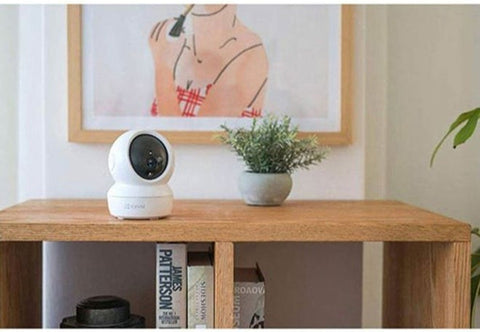 C6N Wi-Fi 2MP 1080P Smart Home Security Camera in white, featuring night vision, motion tracking, and two-way audio for home surveillance.