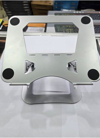 Silver aluminum alloy foldable and adjustable laptop stand, compatible with 14-17 inch laptops, designed for stability and ergonomic support.