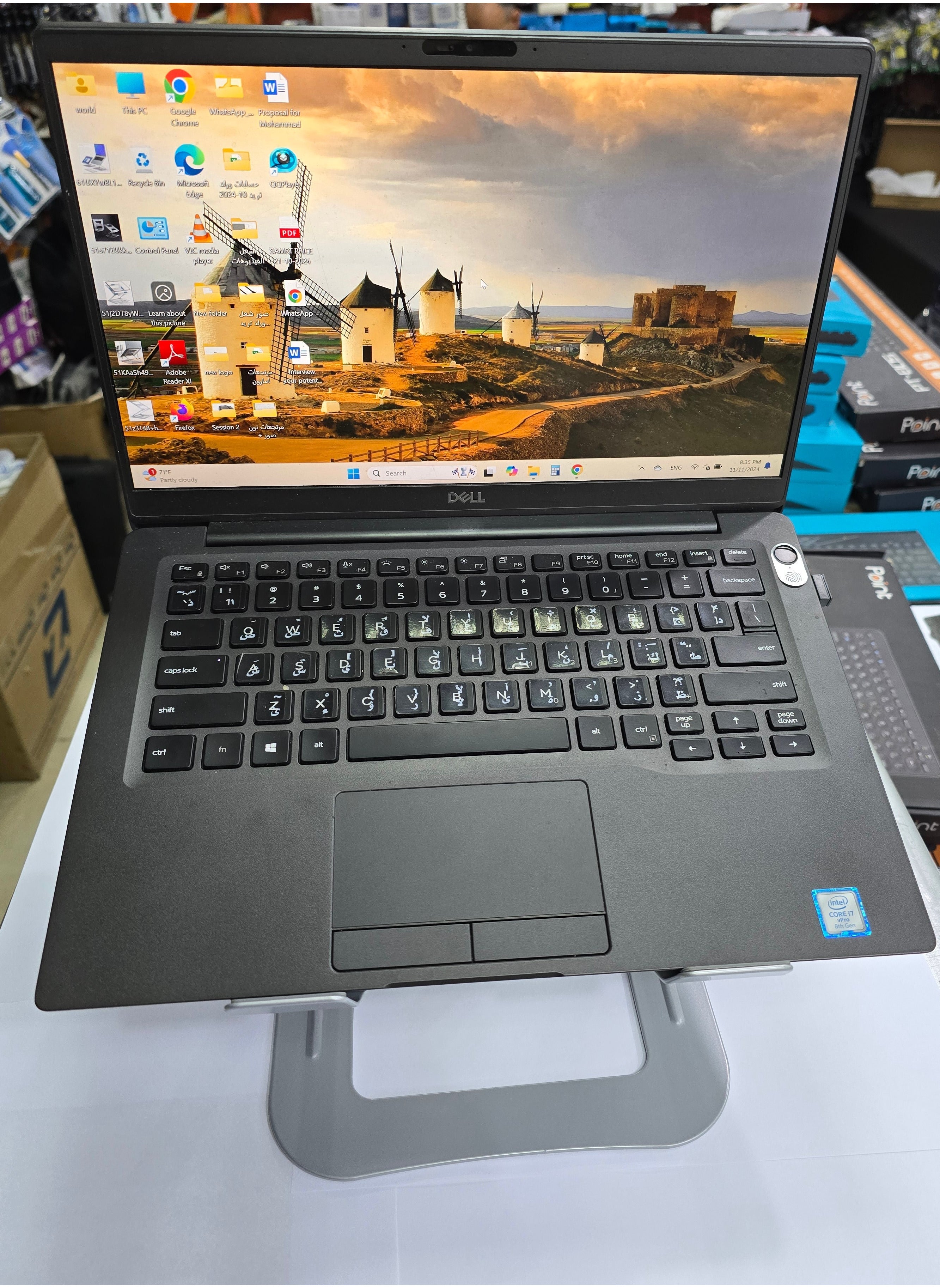 Silver aluminum alloy foldable and adjustable laptop stand, compatible with 14-17 inch laptops, designed for stability and ergonomic support.