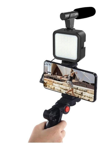 Black flexible tripod with bendable legs, holding a smartphone for video recording, live streaming, and photography